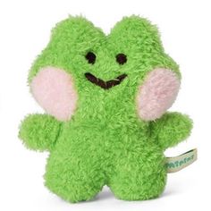 a green stuffed animal with pink ears and eyes