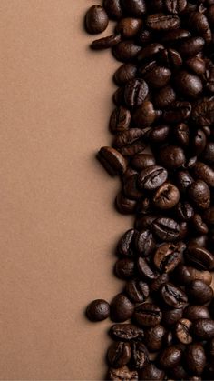 coffee beans are scattered on top of each other