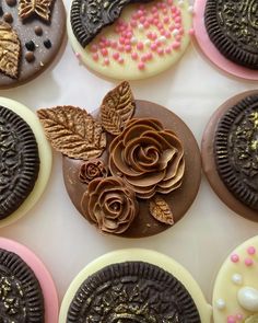 chocolate cookies decorated with flowers and leaves