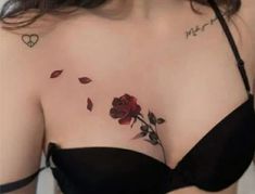 a woman with a rose tattoo on her chest