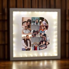 an illuminated photo frame with the letter b surrounded by photos