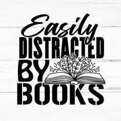 the words easily distracted by books are shown on a white wooden background with black lettering