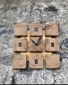 a clock made out of wooden blocks with roman numerals