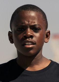 a close up of a person wearing a black shirt