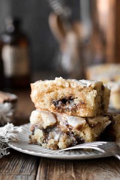 two pieces of cake sitting on top of a white plate