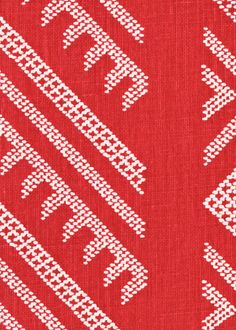 red and white fabric with geometric designs on it