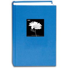 a blue book with a white flower on it