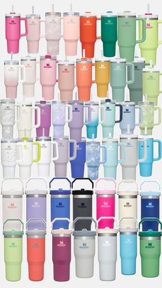 many different colored cups with lids and handles on each one, all lined up in the same row