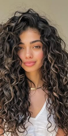 Channel your inner goddess with these divine long curly hairstyles. With 32 breathtaking options to explore, you can embrace your curls and exude confidence and grace with every step. Get ready to radiate beauty and charm! Curl Hair With Highlights, 2b Hair Highlights, Long Curly Hair Wedding, Curly Hairstyles Dyed, Latina Curls, Long Curly Hairstyles, Dark Curly Hair, Dyed Curly Hair