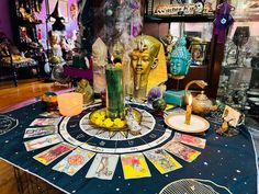 a table topped with lots of cards and candles