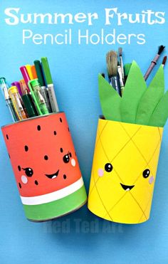 two pineapple and watermelon paper cups with markers, pens and pencils in them