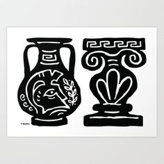 two black and white vases sitting next to each other