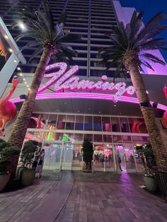 the entrance to flamingo hotel and casino at night