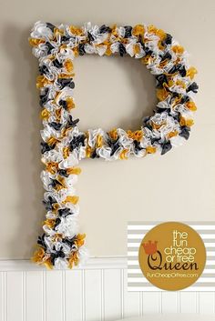 the letter p is made out of crocheted flowers