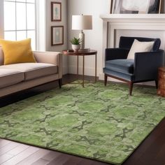 a living room filled with furniture and a green rug on top of a hard wood floor