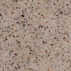 a close up view of the surface of a counter top with small rocks on it