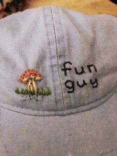 a hat that says fun guy embroidered on the back of it's brim