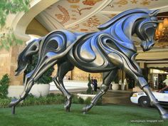 a statue of a horse in front of a building