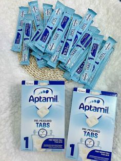 several packs of aptamil preservatized tabs sitting next to each other