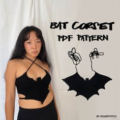 a woman wearing a black crop top with bat crochet on it