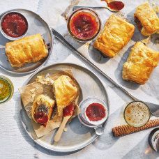 an assortment of pastries and condiments on plates