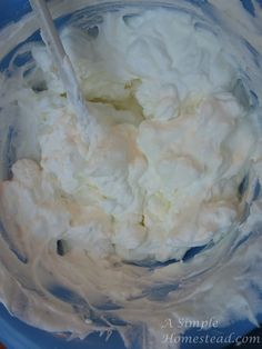 a close up of a cake with white frosting