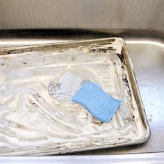 a dirty dish with some blue cloth on it and the words 11 use baking soda to dissose grease on pots and pans