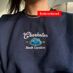 "*SIZES ARE UNISEX* -I'd suggest your usual size for a more fitted look, or sizing up for a more relaxed fit. *these sweatshirts are extra comfy when oversized \"Charleston South Carolina 1783\" embroidered on a cute vintage-style crewneck. A cozy sweatshirt bound to keep you warm in the colder months. A pre-shrunk, classic fit sweater that's made with air-jet spun yarn for a soft feel and reduced pilling. Your new favorite sweatshirt! * 50% cotton, 50% polyester * Pre-shrunk * Classic fit with no center crease * 1x1 athletic rib knit collar with spandex * Air-jet spun yarn with a soft feel and reduced pilling * Double-needle stitched collar, shoulders, armholes, cuffs, and hem * Gildan 18000 Unisex Heavyblend Sweatshirt Please note that the embroidery comes with a backing that acts as a s South Carolina Sweatshirt, Custom Bachelorette Shirts, Custom Bachelorette, Vintage Crewneck Sweatshirt, Bachelorette Shirt, Vintage Pullovers, Bachelorette Shirts, Charleston South Carolina