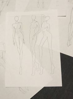 several drawings of female mannequins on paper