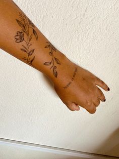 a person's foot with tattoos on it