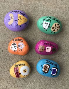 four painted rocks with words written on them