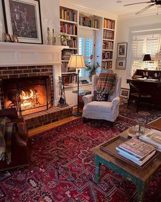 a living room filled with furniture and a fire place