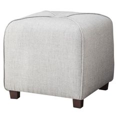 the foot stool is upholstered with wood legs