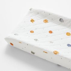 an image of a baby's bed with planets printed on the mattress and sheets