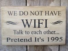 a wooden sign that says we do not have wifi talk to each other pretend it's 955