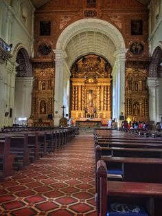 the inside of an old church with pews