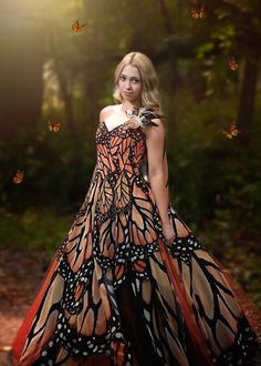 If you've ever admired the beauty of the Monarch butterfly, this gown is for you! This unique gown is made of a Monarch butterfly wing printed fabric over a full, tulle hoop skirt. The dress is 3 pieces - the hoop skirt, the tulle and fabric overskirt and the steel boned corset top. This dress is an absolute showstopper and makes magic in any photo setting. This butterfly gown has gone viral on social media and is highly sought after by photographers for the fantasy feel it lends to a shoot. This dress is a woman's size 10 and can easily work up a size or down a few sizes. Very flexible in fit. Measurements: Across the chest - 14 inches (corset back) Across the waist - 15 inches Waist to hem - 44 inches Monarch Butterfly Outfit, Butterfly Wing Dress, Rent Costumes, Monarch Butterfly Costume, Butterfly Gown, Photo Setting, Butterfly Costume, Steel Boned Corsets, Hoop Skirt