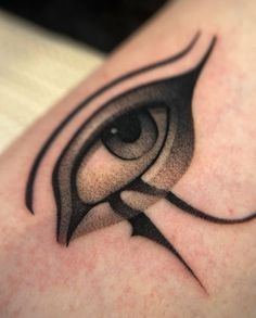 an eye tattoo is shown on the arm