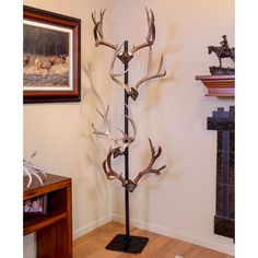 the antlers are mounted to the wall in this living room