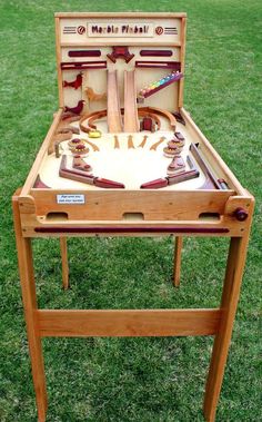 a wooden table that has some kind of game on it with instructions for how to play