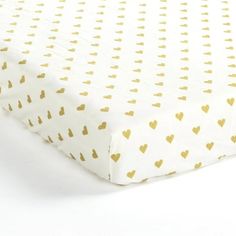 The soft plush fabric and adorable metallic heart print on this fitted crib sheet make this the perfect addition to your little one's nursery. This stylish pattern of this Boho Metallic Hearts All Over Soft & Plush Fitted Crib Sheet fits into many nursery themes and is a fun and chic piece to add to your nursery decor. Get ready to style a glitzy and glamorous nursery for your little fashionista with this Boho Metallic Hearts All Over Soft & Plush Fitted Crib Sheet. Be inspired by the pops of me White And Gold Nursery, Boho Chic Nursery, Heart Nursery, Gold Nursery, Toddler Beds, Lush Decor, White Sheets, Garment Steamer, Metallic Prints