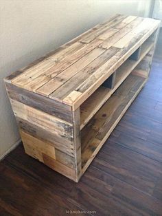 a wooden shelf sitting on top of a hard wood floor