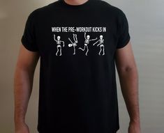 a man wearing a t - shirt that says when the pre - workout kicks in