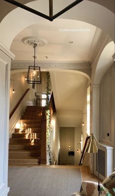 an archway leading to the second floor in a house