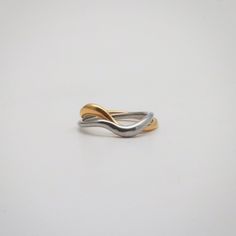 Gold and silver wave ring cross over each other, just like a couple in deep love. 18k gold plated Gold and silver color Stainless steel base Waterproof and tarnish free Available in US size 5-7 Ring sizing chart Ring Sizing Chart, Wave Rings, Waves Ring, Wishlist 2022, Throwing Fits, Mixed Metal Rings, Liz Taylor, Carved Ring, Gift Inspo