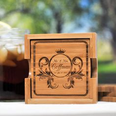 a wooden coaster with the words mr and mrs on it next to a jar of iced tea