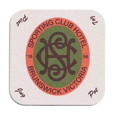 a coaster with the words sporting club hotel brinswick victoria in red and green