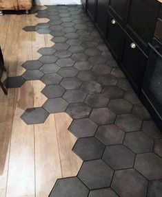 a kitchen floor with hexagonal tiles on it