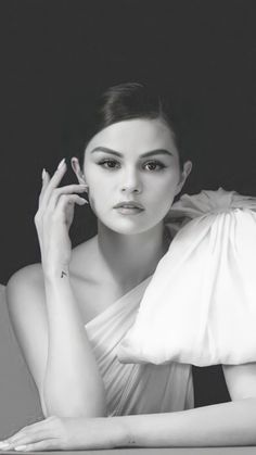 black and white photograph of a woman with her hands on her face