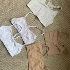 Lot Of 5 Bralettes / Bras Includes One Brand New, Never Worn Size Xs White Gap Bralette, One Xs Gap White Bralette (Worn But Good Condition), One Scoop Neck Off White Aerie Bralette, One Gap Love Xs Tan Seamless Bralette And One Size Xxs Tan. Smoke Free Home. Good Condition! Hard To Find This Size So This Makes For A Great Deal! White Sports Bra With Built-in Bra For Summer, Everyday White Tops With Seamless Construction, White Seamless Tops For Everyday, White Everyday Tops With Seamless Design, White Seamless Tank Top For Everyday, White Seamless Everyday Tank Top, Casual Everyday Summer Bra, Summer Everyday Bra, White Sports Bra With Removable Pads